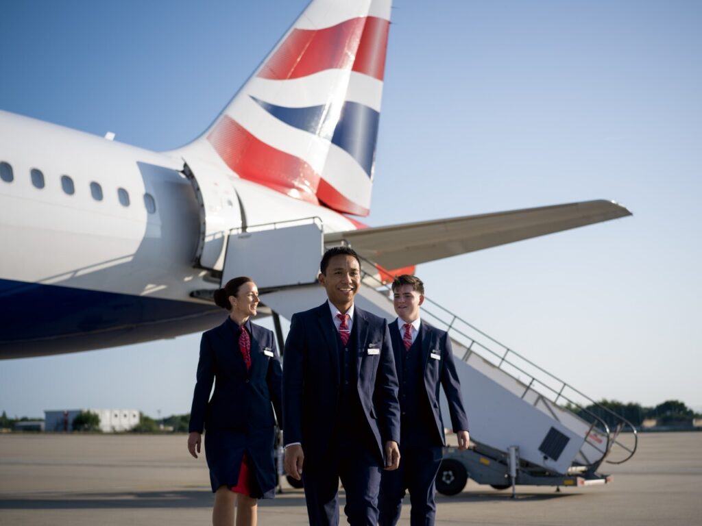 Euroflyer cabin crew walking Gatwick Airport airside.