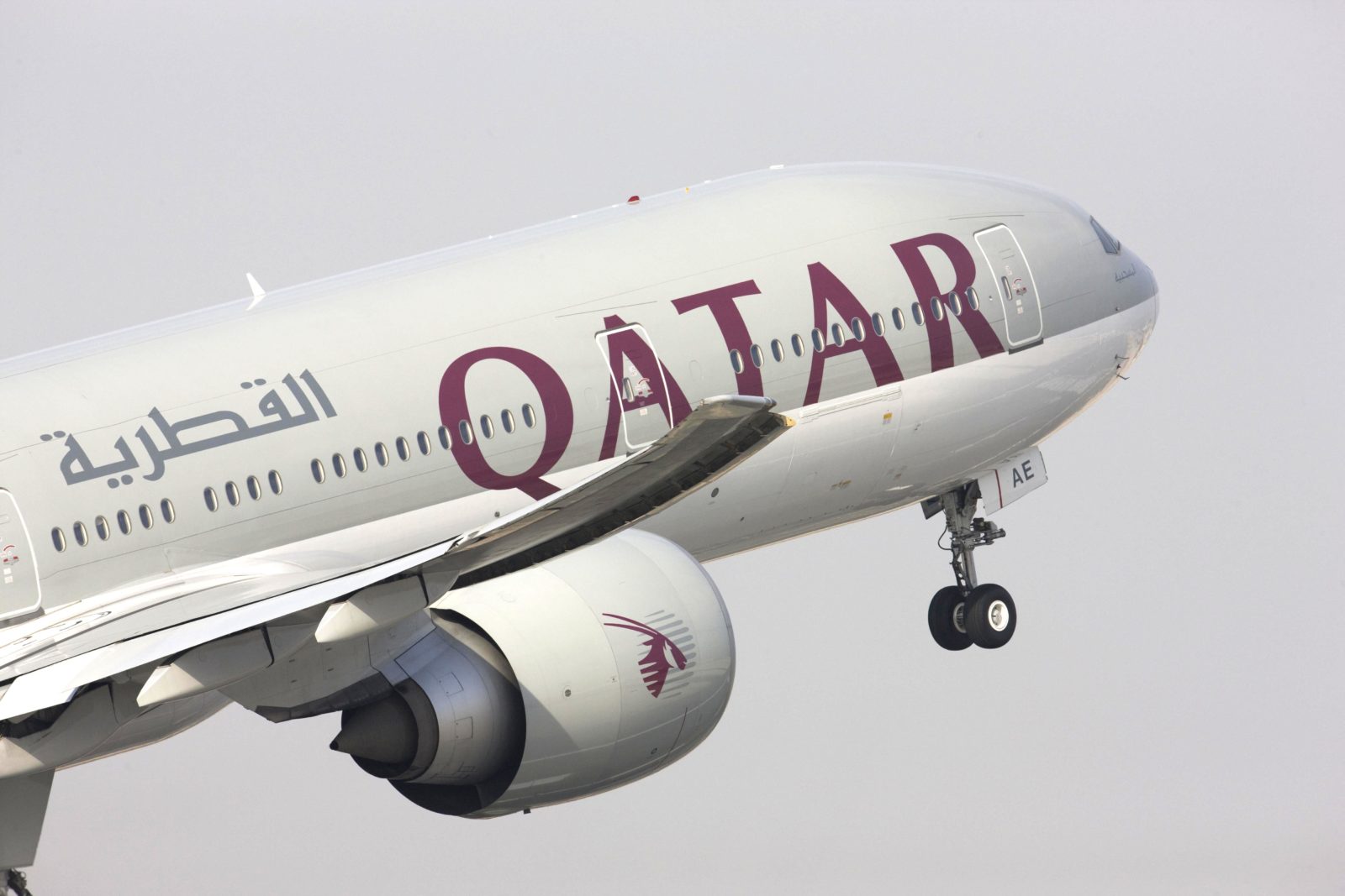 a qatar airways plane in the sky