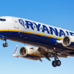 a ryanair plane flying in the sky