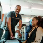 jetblue flight attendant serving a customer