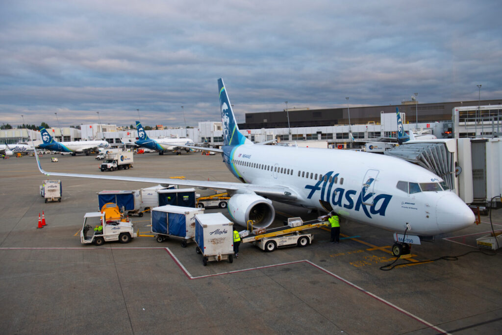 an alaska airlines boeing 737 parked at the gate