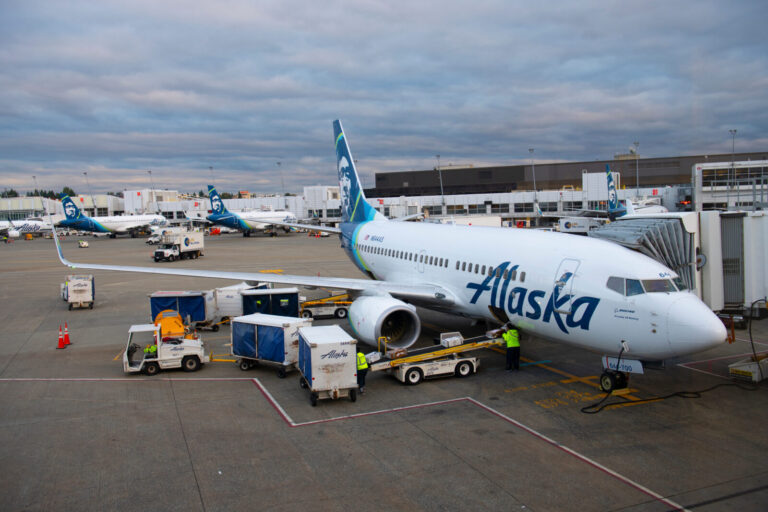 an alaska airlines boeing 737 parked at the gate