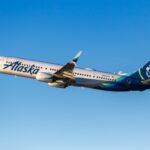 an alaska airlines boeing 737 flying in the sky