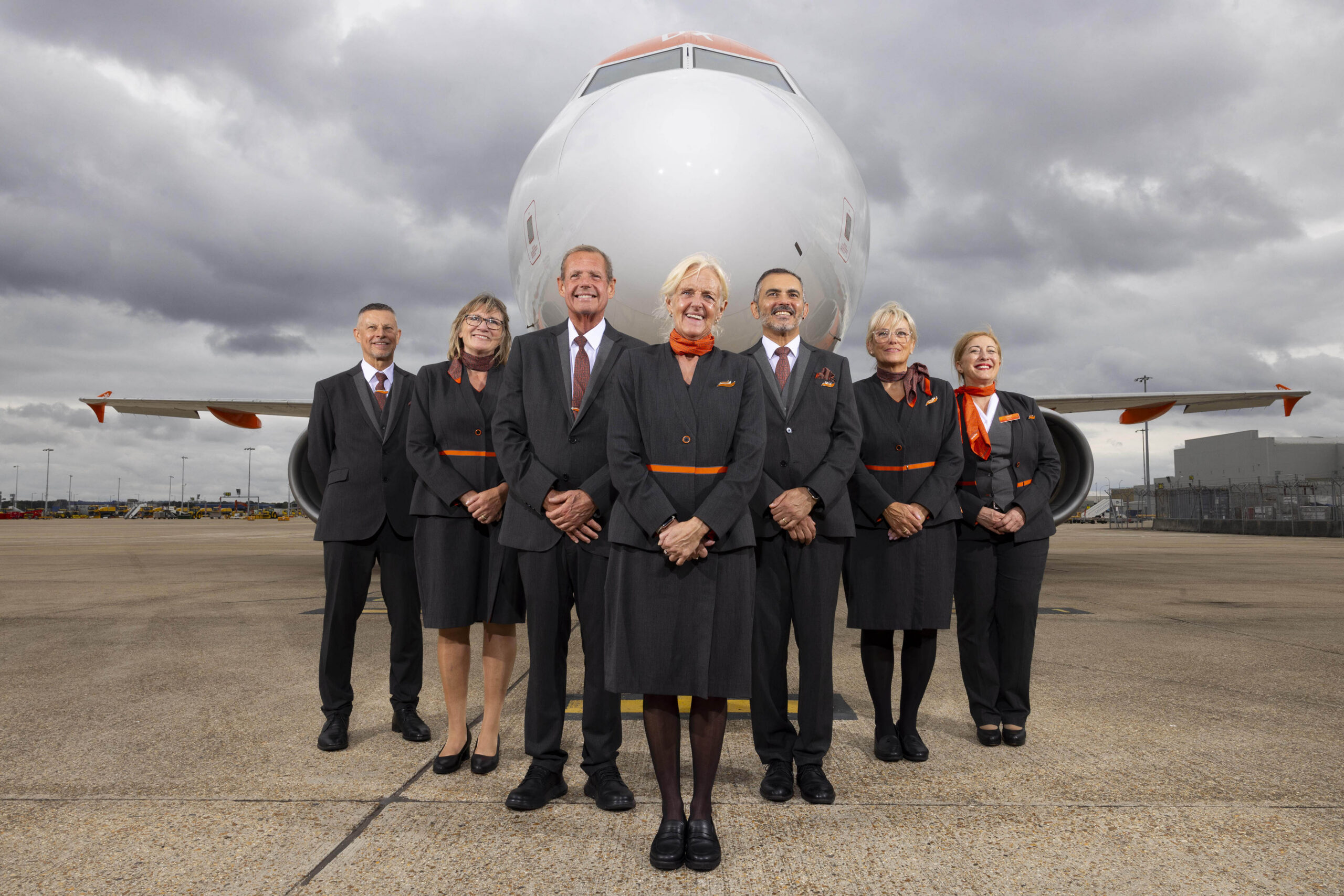 easyjet cabin crew standing in front of a plane
