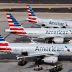 american airlines planes lined up at their gates