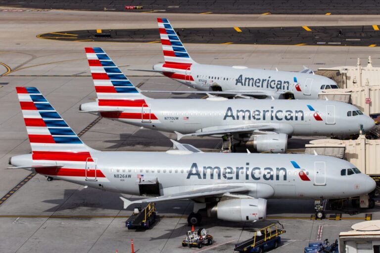 american airlines planes lined up at their gates