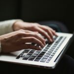 someone typing on a computer
