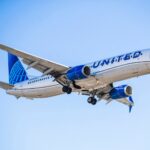 a united airline plane in the sky